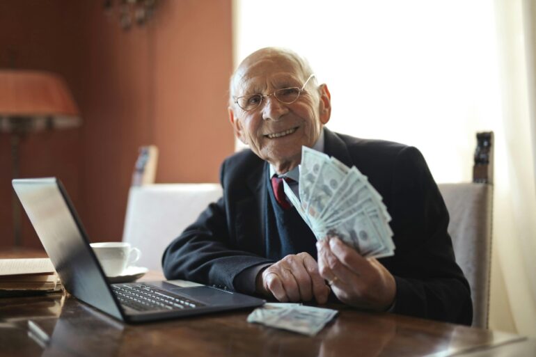 a senior holding money